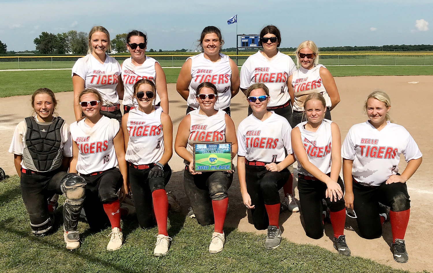 Belle Lady Tiger softball team members gather for a team picture with the third-place plaque from the Montgomery County Fall Classic Softball Tournament at Montgomery County High School.
